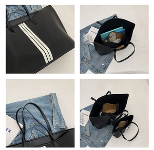 Large black nylon tote bag with white side stripes and inner zipper pouch
