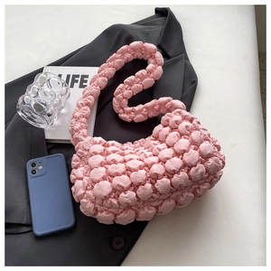 Close-up of pink bubble pleated texture on cloud-style underarm shoulder bag