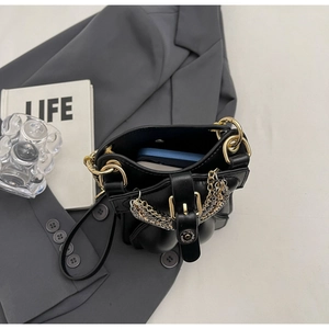 Detail view of mini leather crossbody bag showing interior capacity for a large smartphone
