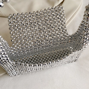 Handmade silver beaded punk shoulder bag with metallic rivets and hobo half-moon shape