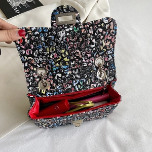 Colorful tweed chain shoulder bag with metal lock and red lining interior view