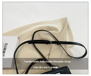 Detail showing adjustable leather shoulder strap with metal buckle on black crossbody bag