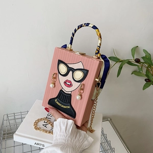 Pink box clutch bag with artistic female illustration and silk scarf handle detail