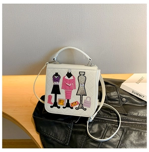 Detailed embroidery and sequins on a white quilted square handbag with floral fashion motif