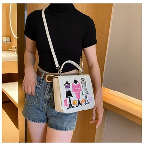 Detail of white cross-body bag featuring stylish fashion model patchwork embroidery