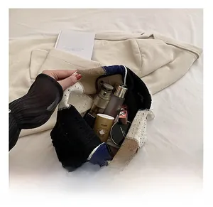 Top view of spacious color-block knit tote showing internal capacity for daily essentials