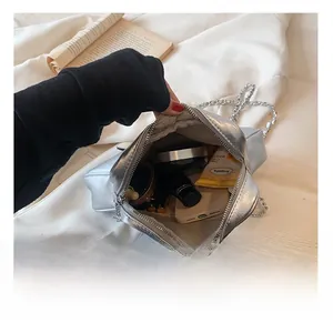 Interior view of star-shaped silver crossbody bag showing capacity for daily essentials