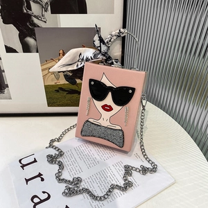 Detail of pink box bag with fashion lady illustration and silk scarf handle wrap
