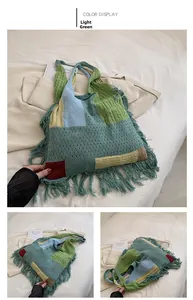 Detail of multi-color patchwork knit tote bag with long fringe and rich woven texture