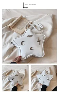 White star-shaped crossbody bag with silver planet and moon metal accents and strap