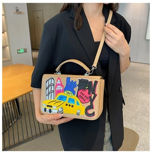 Detail of vintage Baroque handbag with NYC New York themed embroidery and top handle