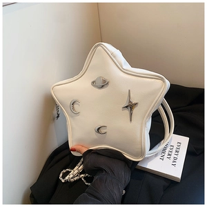 Star-shaped white leather crossbody bag featuring silver cosmic badges and chain strap