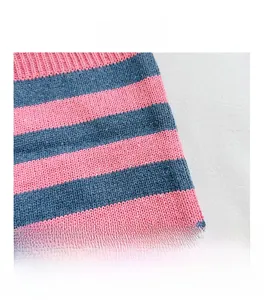 Macro shot of pink and blue striped knit fabric texture showing fine stitching details