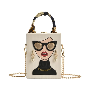Chic box bag with fashion illustration, silk handle wrap and gold chain strap