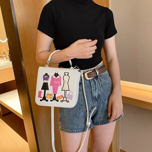 White quilted shoulder bag featuring stylish fashion model embroidery and top handles