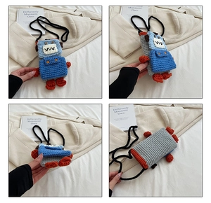 Macro detail of a handmade crochet robot crossbody bag with blue and grey knit patterns