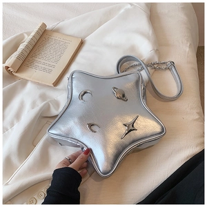 Star-shaped silver metallic shoulder bag with celestial charms and chain strap detail