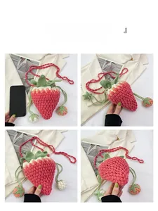 Detail view of handmade crochet strawberry bag showing woven texture and leaf accents