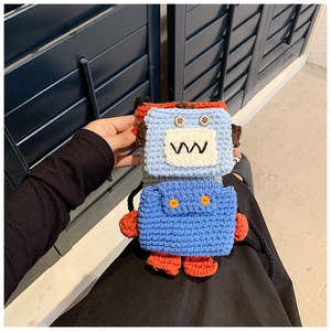Handmade crochet robot crossbody bag with blue body, orange accents and button eyes