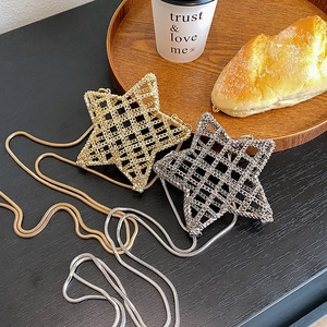 Mini star-shaped metal chain bag with woven hollow design and sleek snake chain strap