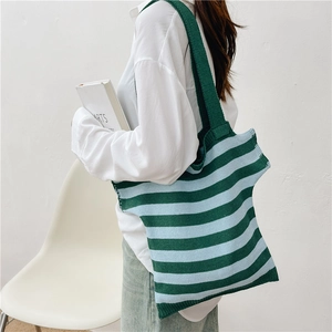Knitted tote bag with dark green and light blue stripes and comfortable shoulder straps