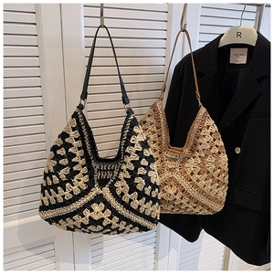 Detailed macro view of bohemian hand-woven crochet hobo tote bag in mixed patterns