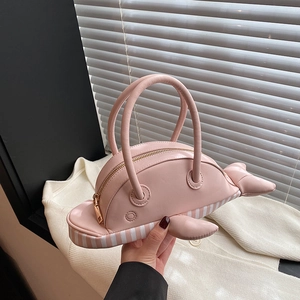 Creative pink whale shaped crossbody bag with gold zipper and unique 3D fin details
