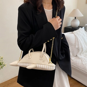 Creative whale-shaped crossbody bag for women with gold chain strap in creamy white