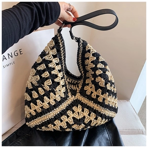 Macro view of hand-crocheted geometric hollow pattern and premium leather shoulder strap