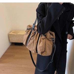 Large khaki nylon tote bag for women showing a spacious functional shoulder bag