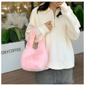 Detail of pink faux fur tote bag showing the soft plush texture and spacious handle