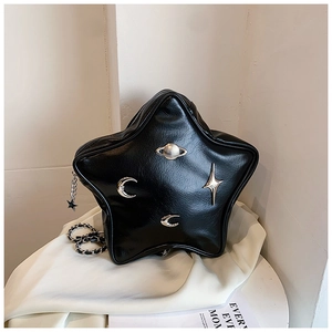 Detail of black star-shaped PU leather bag with silver planetary metal ornaments and chain