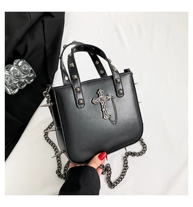 Gothic punk handbag featuring silver cross pendant, rivets, and side spikes details