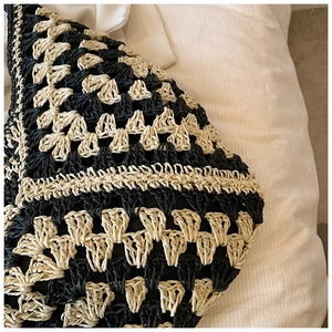 Close-up of handmade crochet weave pattern with geometric hollow design on tote bag