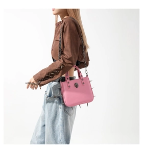 Pink gothic handbag with metal spikes, punk rivets and skull badge detail