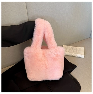 Detail of pink faux fur plush tote bag showing soft texture and cozy winter fashion style