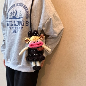 Handmade crochet cartoon crossbody bag with thick lips and polka dot bow detail