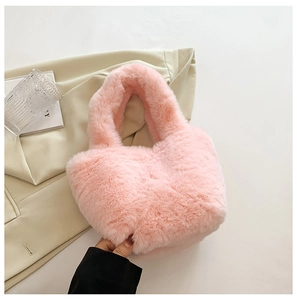 Close-up of fluffy pink faux fur tote bag showing soft plush texture and integrated handle