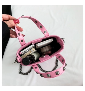 Inside view of pink mini gothic tote bag with silver rivets and metal chain strap