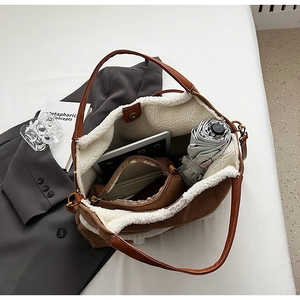 Internal view of large brown sherpa tote bag showing spacious capacity and magnetic closure