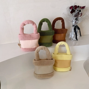 Faux shearling bucket bags in five colors with plush handles and metal chains