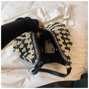 Detail of hand-woven tote showing interior magnetic closure and daily essentials capacity