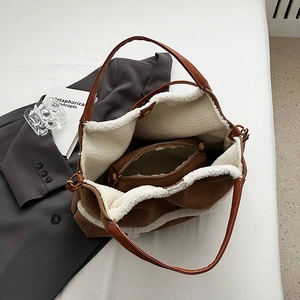 Brown fleece-lined tote bag with matching inner pouch on minimalist white background