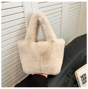 Close-up of soft plush faux fur tote bag in beige with dense fluffy texture detail