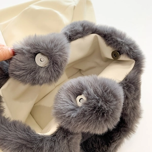 Chic grey faux fur plush bucket handbag with magnetic closure and soft lining