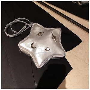 Detailed view of Y2K style silver star-shaped crossbody bag with metallic planet charms