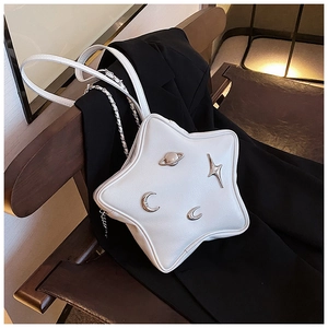 Detailed view of white star-shaped PU leather crossbody bag with silver celestial charms