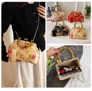 Detail of vintage floral embroidered satin handbag with bamboo handle and silk tassel