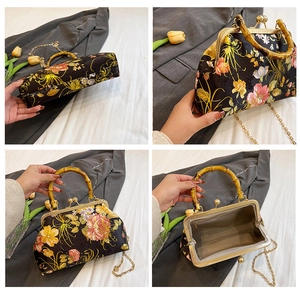 Macro detail of floral embroidery and natural bamboo handle on a satin handbag