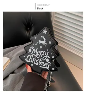Close-up of black Christmas tree bag with Merry Christmas text and elk patterns
